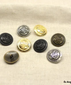 Bouton Blason 2 volutes couronnées 23 mm